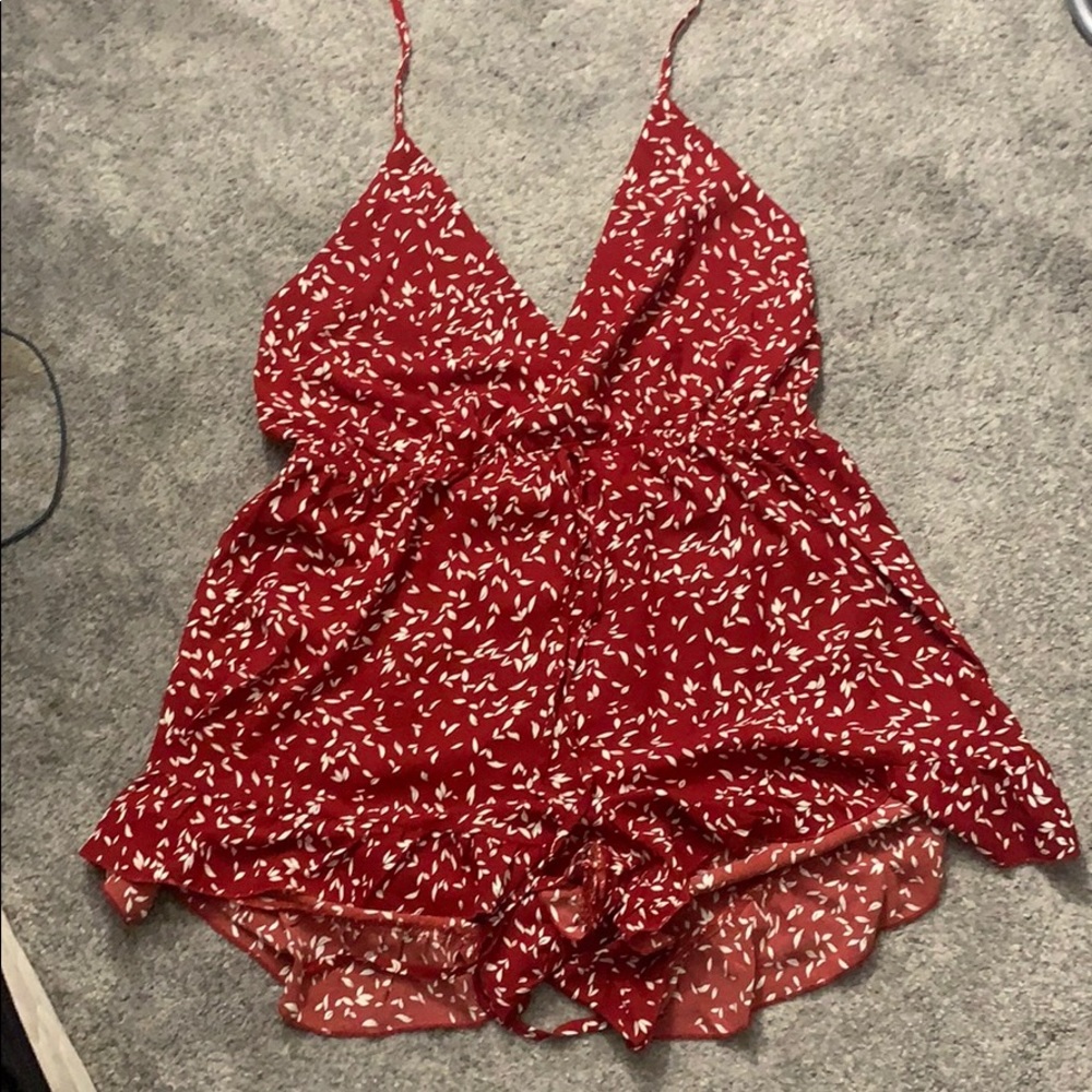Red romper with white leaves